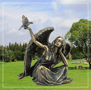 bronze sitting angel girl speaking with a bird